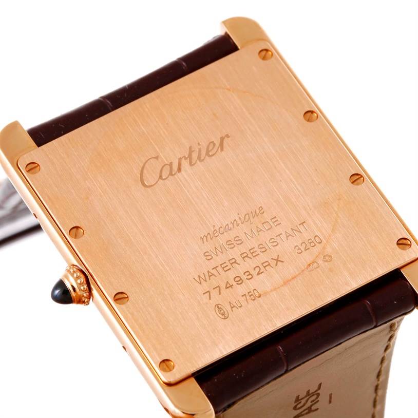 The image shows the back of a Cartier Tank Louis W1560017 Men's Rose Gold Silver Dial W1560017 Men's Rose Gold Silver Dial watch, highlighting the case back, inscriptions, and part of the leather strap.