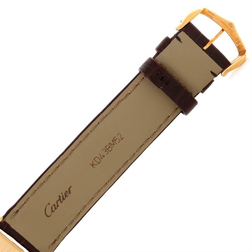 This image shows the backside of the Tank Louis Cartier watch strap and buckle, featuring the Cartier logo and serial number.