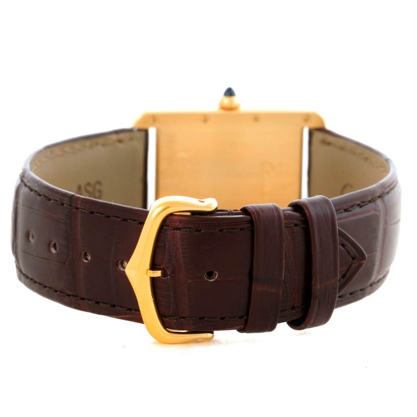 This image shows the back view of the Cartier Tank Louis W1529756 Men's Yellow Gold Silver Dial W1529756 Men's Yellow Gold Silver Dial watch, highlighting the leather strap and gold buckle.