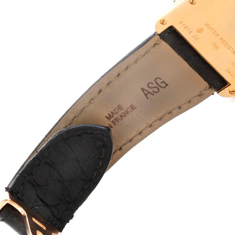 This image shows the back side of the strap and part of the case of a Cartier Tank Louis W1529756 Men's Yellow Gold Silver Dial W1529756 Men's Yellow Gold Silver Dial watch.