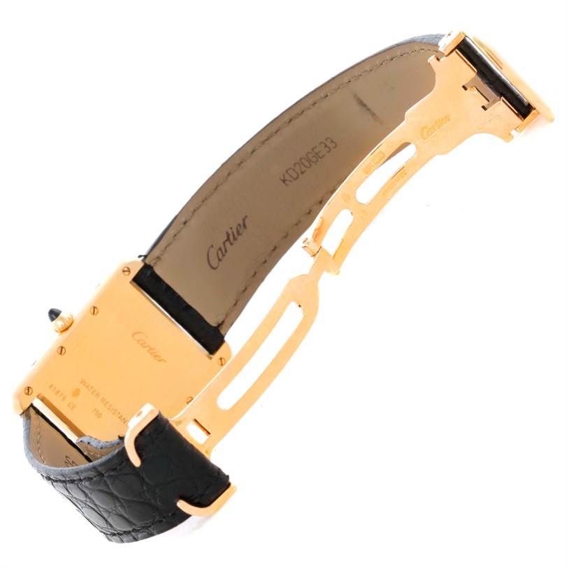 This image shows the back and interior of a Cartier Tank Louis W1529756 Men's Yellow Gold Silver Dial W1529756 Men's Yellow Gold Silver Dial watch, highlighting the clasp, leather strap, and back case.
