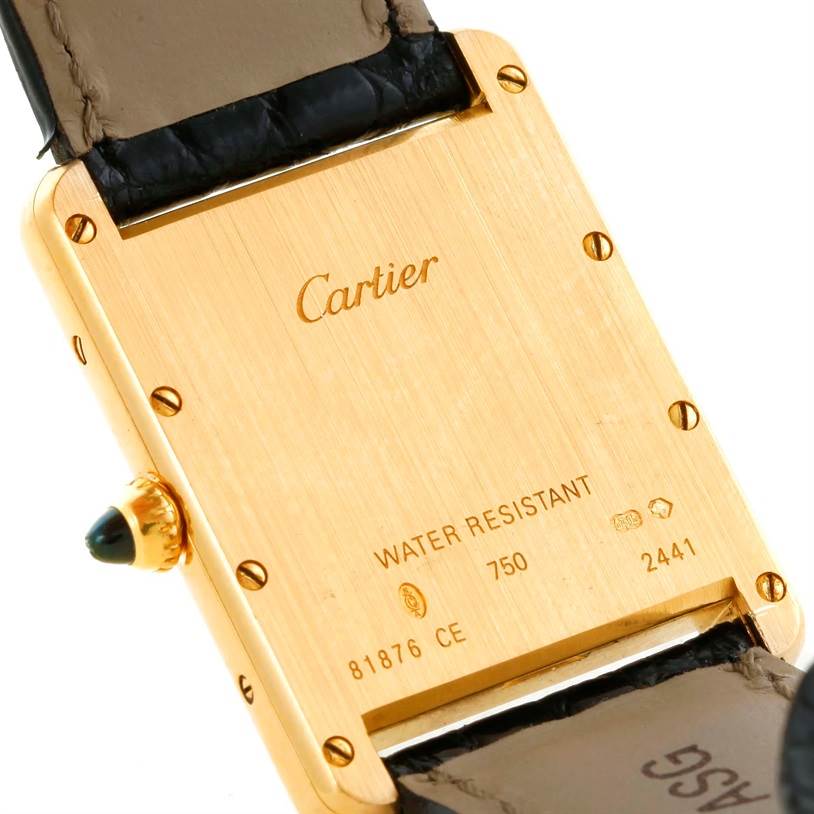 The image shows the back case of a Cartier Tank Louis W1529756 Men's Yellow Gold Silver Dial W1529756 Men's Yellow Gold Silver Dial watch, highlighting the brand name, water resistance, and model details.