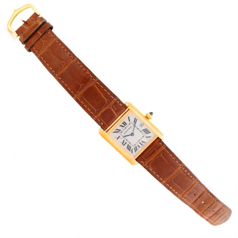 This image shows the front view of a Cartier Tank Louis Men's Yellow Gold Silver Dial Men's Yellow Gold Silver Dial watch, featuring a brown leather strap and rectangular gold case.