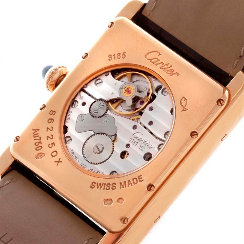 The image shows the back view of the Cartier Tank Louis W1560002 Men
s Rose Gold Brown Dial W1560002 Men
s Rose Gold Brown Dial watch, highlighting its exposed mechanical movement.