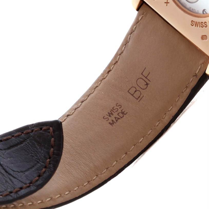 This is a close-up view of the leather strap of a Cartier Tank Louis W1560002 Men
s Rose Gold Brown Dial W1560002 Men
s Rose Gold Brown Dial watch, showing the stitching and engraved markings.