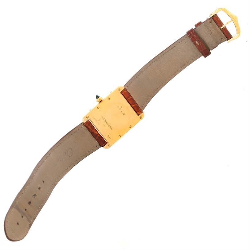 The image shows the back view of a Cartier Tank Louis W1529756 Men's Yellow Gold Silver Dial W1529756 Men's Yellow Gold Silver Dial watch, highlighting the gold case and leather strap with the buckle.