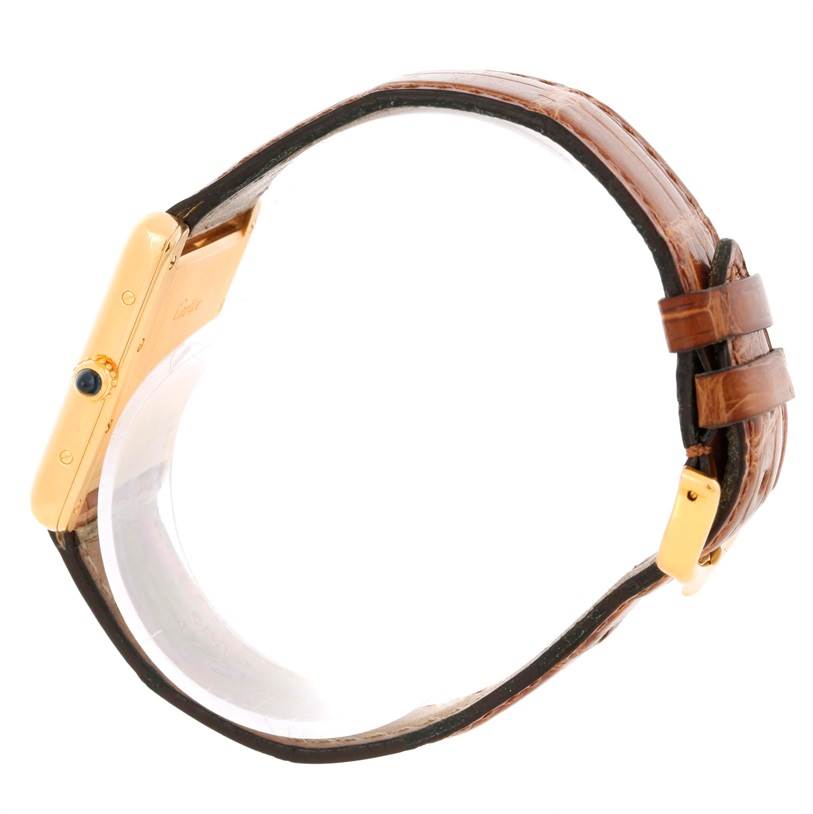 The image shows a side view of a Cartier Tank Louis W1529756 Men's Yellow Gold Silver Dial W1529756 Men's Yellow Gold Silver Dial watch, focusing on the case, crown, and leather strap.