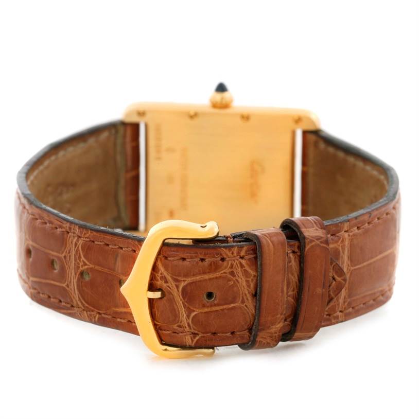The image shows the back view of the Tank Louis model by Cartier, focusing on the strap and buckle.