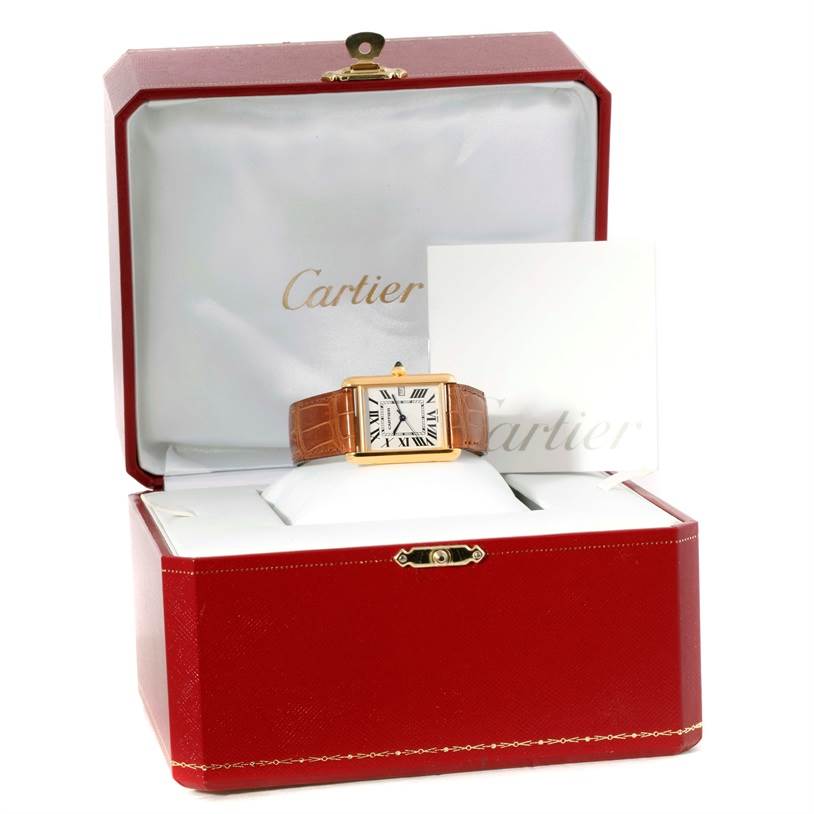 The Cartier Tank Louis W1529756 Men's Yellow Gold Silver Dial W1529756 Men's Yellow Gold Silver Dial watch is displayed front-facing, placed inside an open red Cartier box with a cushion and a booklet.