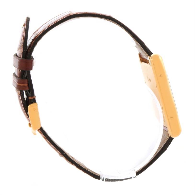 The image shows a side view of a Cartier Tank Louis W1529756 Men's Yellow Gold Silver Dial W1529756 Men's Yellow Gold Silver Dial watch, highlighting the gold case and brown leather strap.