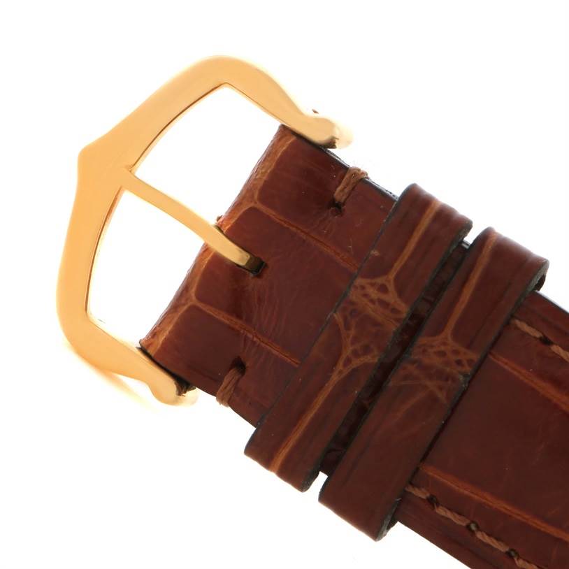 The image shows a close-up of the brown leather strap and golden buckle of the Cartier Tank Louis W1529756 Men's Yellow Gold Silver Dial W1529756 Men's Yellow Gold Silver Dial watch.