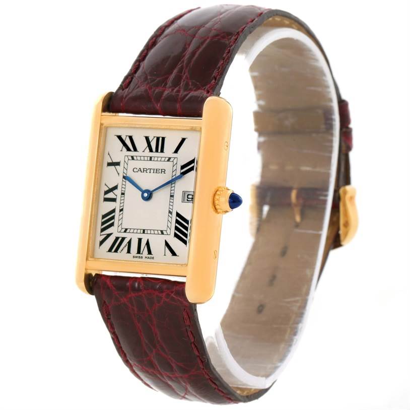 The Cartier Tank Louis W1529756 Men's Yellow Gold Silver Dial W1529756 Men's Yellow Gold Silver Dial watch is shown at a slight angle, highlighting its rectangular face and brown leather strap.