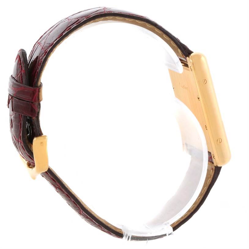 The image shows a side view of the Cartier Tank Louis W1529756 Men's Yellow Gold Silver Dial W1529756 Men's Yellow Gold Silver Dial watch, highlighting the case, bezel, and leather strap.