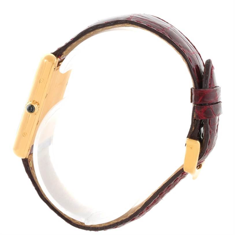 The image shows a side view of the Cartier Tank Louis W1529756 Men's Yellow Gold Silver Dial W1529756 Men's Yellow Gold Silver Dial watch, highlighting the gold case and leather strap.