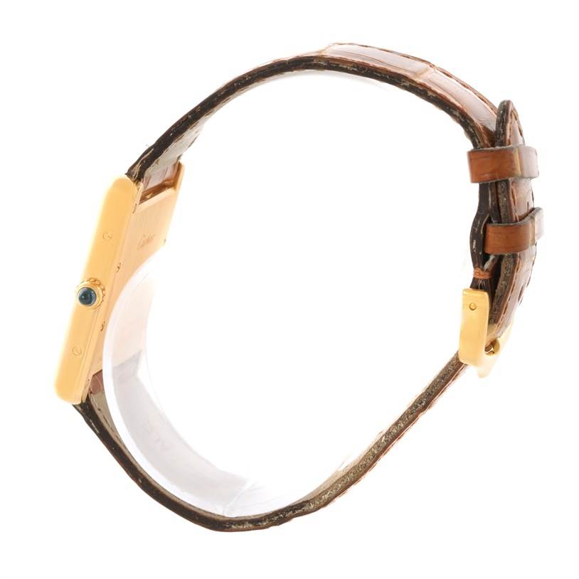 The image shows a Cartier Tank Louis W1529756 Yellow Gold Silver Dial W1529756 Yellow Gold Silver Dial watch from the side, featuring the case, leather strap, and buckle.