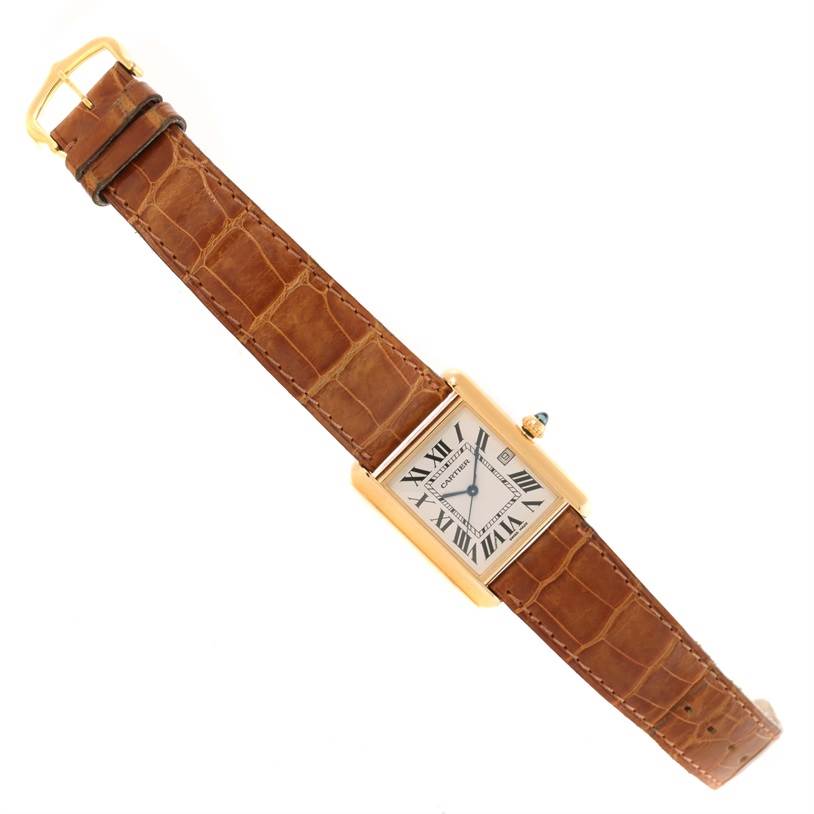 The image shows a top-down view of the Cartier Tank Louis W1529756 Yellow Gold Silver Dial W1529756 Yellow Gold Silver Dial watch, displaying its face, brown leather strap, and gold-colored case.