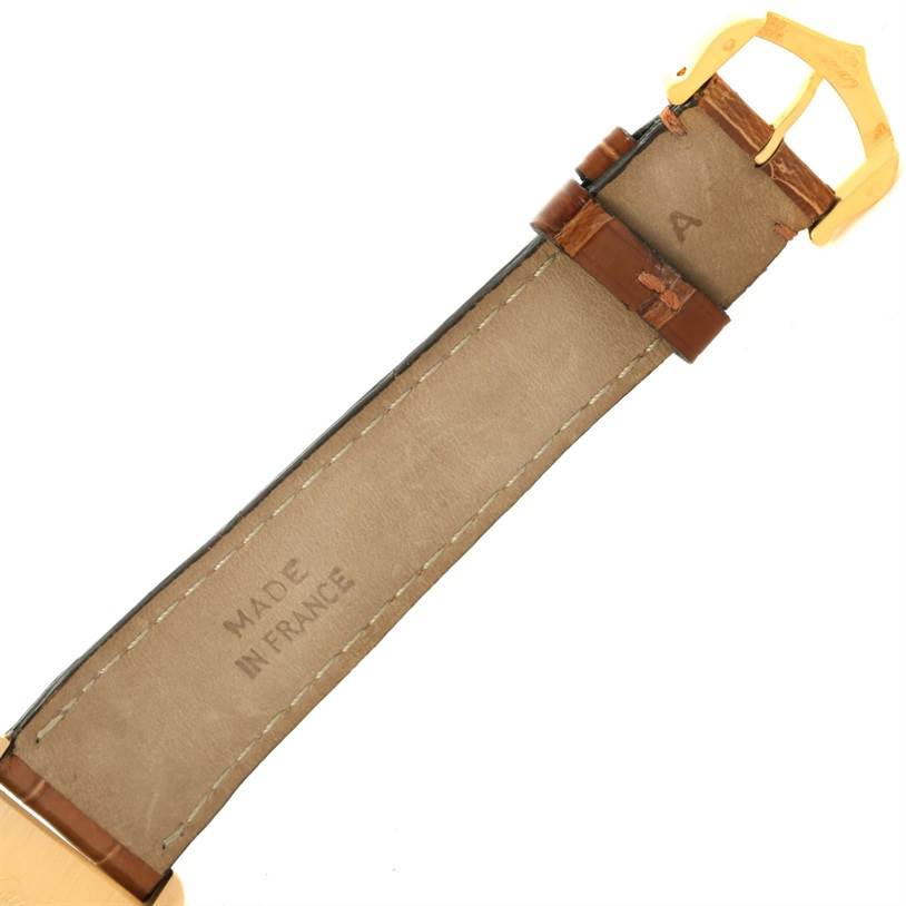 The image shows the underside of the leather strap and buckle of a Tank Louis watch by Cartier.