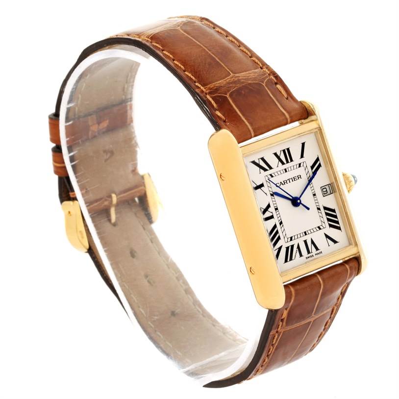 The image shows a Tank Louis model by Cartier from a three-quarter angle, featuring its face, gold case, and brown leather strap.