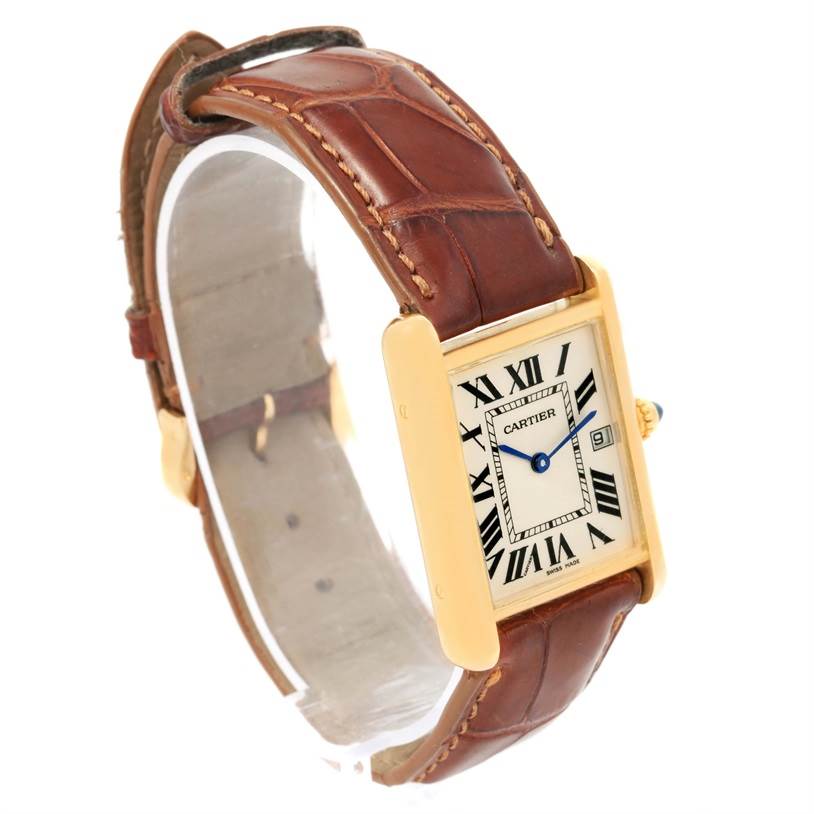 The image shows a Cartier Tank Louis W1529756 Men's Yellow Gold Silver Dial W1529756 Men's Yellow Gold Silver Dial model watch at an angled view, highlighting its gold case, Roman numeral dial, and brown leather strap.