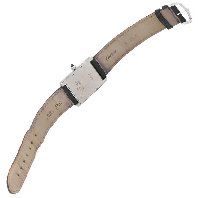 The image shows the back and strap of a Tank Louis model watch by Cartier from an overhead angle.