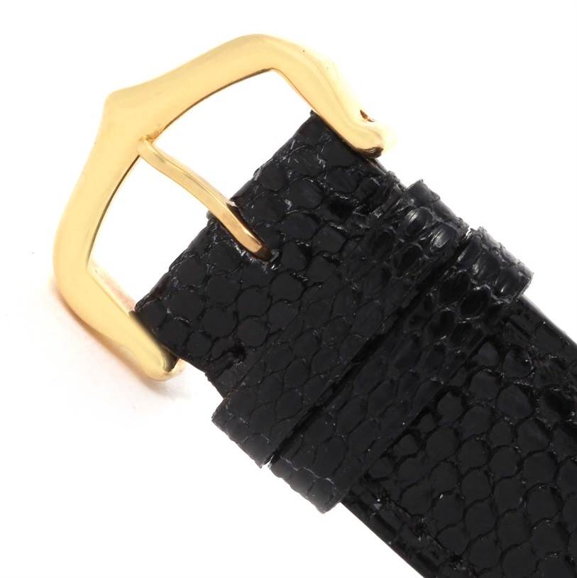 This image shows the gold buckle and black leather strap of the Cartier Tank Louis W1529756 Men's Yellow Gold Silver Dial W1529756 Men's Yellow Gold Silver Dial watch, viewed from a close-up angle.