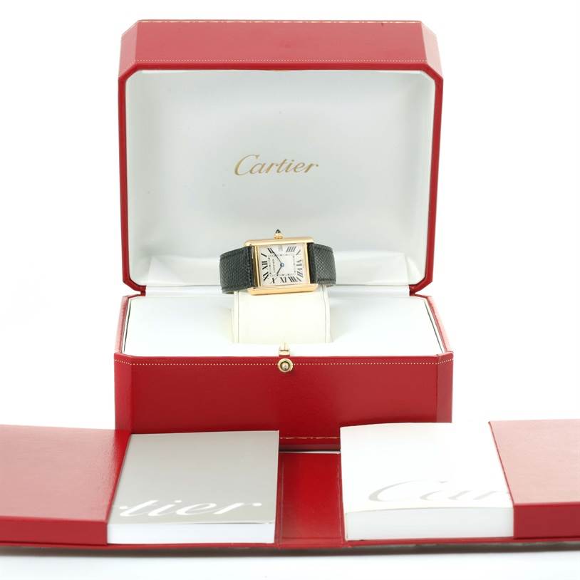 The Cartier Tank Louis W1529756 Men's Yellow Gold Silver Dial W1529756 Men's Yellow Gold Silver Dial watch is displayed frontally in its open red box, along with accompanying documents.