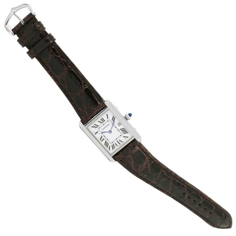 The Cartier Tank Louis W1540956 Men's White Gold Silver Dial W1540956 Men's White Gold Silver Dial watch is shown from an angled top view, displaying its rectangular face and leather strap.