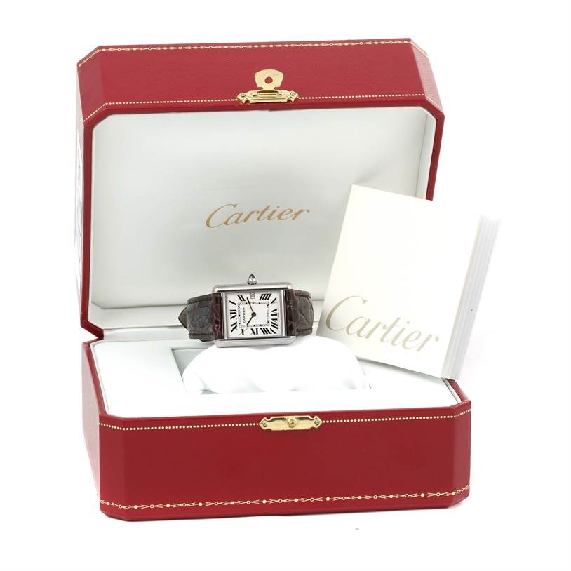 The Cartier Tank Louis W1540956 Men's White Gold Silver Dial W1540956 Men's White Gold Silver Dial watch is shown front-facing in an open red box with accompanying papers.