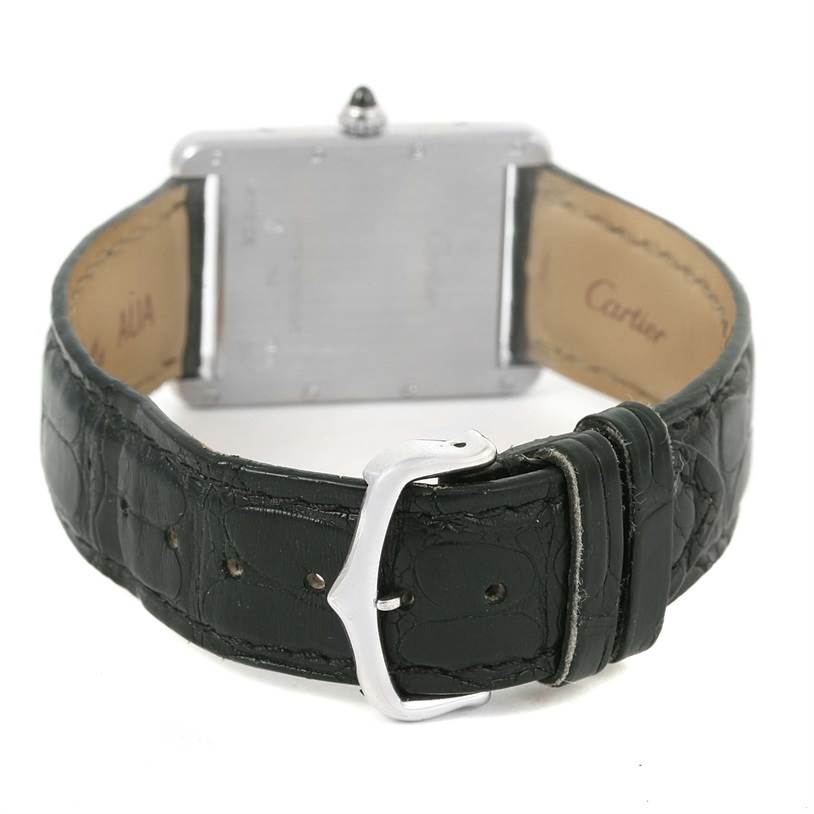 The image shows the back view of a Tank Louis watch by Cartier, displaying its leather strap and clasp.