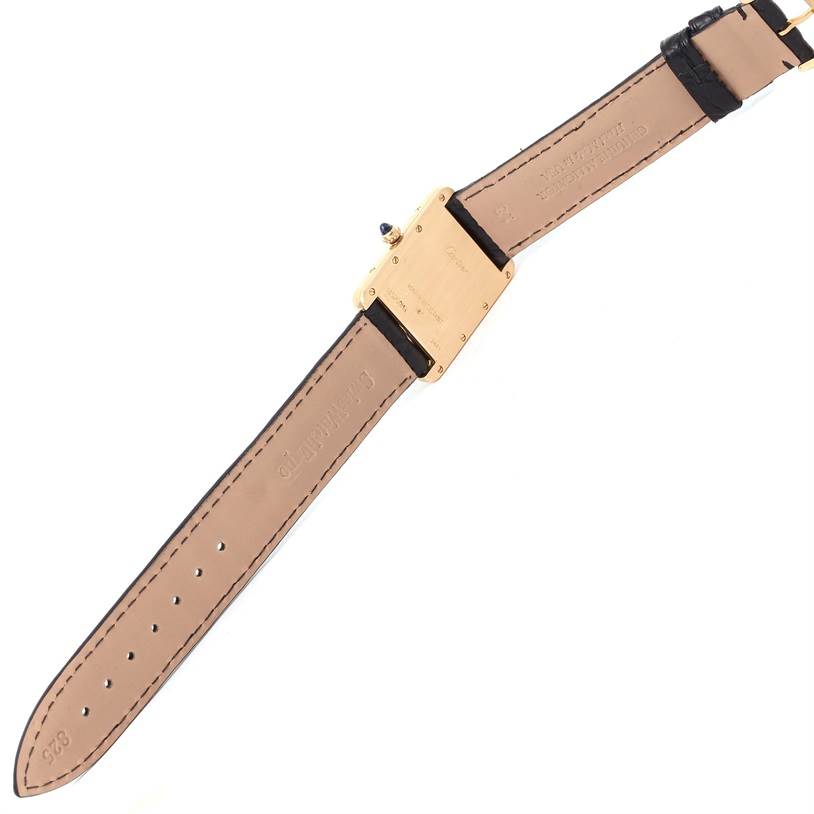 This image shows the underside of the Cartier Tank Louis W1529756 Men's Silver Dial W1529756 Men's Silver Dial model watch, featuring its case back and leather strap.