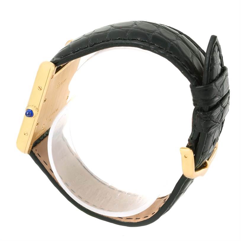 The image shows the side and back of a Cartier Tank Louis W1529756 Men's Silver Dial W1529756 Men's Silver Dial watch, highlighting the gold case, crown with blue cabochon, and black leather strap.