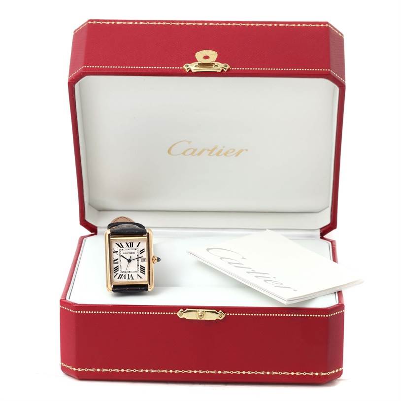 This image shows a Cartier Tank Louis W1529756 Men's Silver Dial W1529756 Men's Silver Dial watch displayed in its open red box with a booklet.