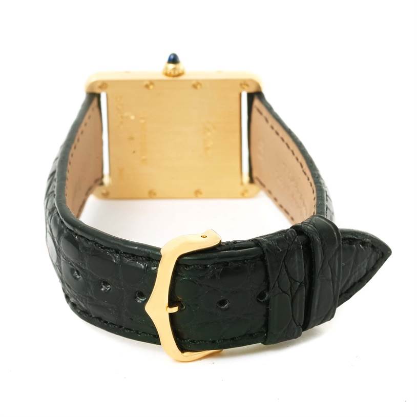 The image shows the back view of the Cartier Tank Louis W1529756 Men's Silver Dial W1529756 Men's Silver Dial watch, focusing on its gold case, black leather strap, and gold buckle.