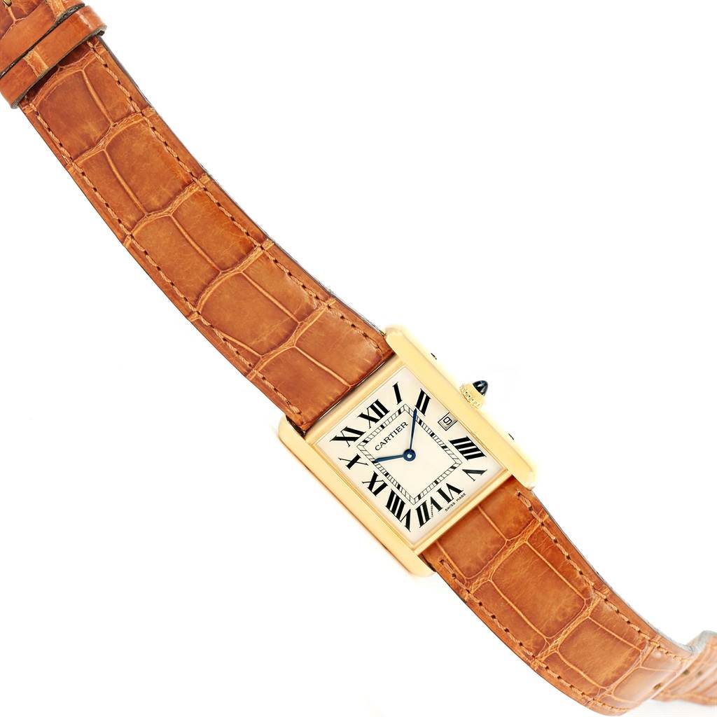 The Cartier Tank Louis W1529756 Yellow Gold Silver Dial W1529756 Yellow Gold Silver Dial watch is shown from an overhead angle, displaying the face, case, and strap.