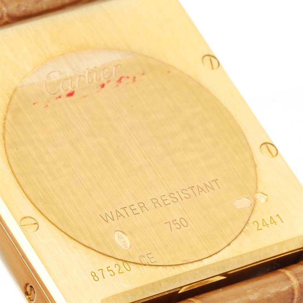 This is the back view of a Cartier Tank Louis W1529756 Yellow Gold Silver Dial W1529756 Yellow Gold Silver Dial watch, showing its caseback and part of the strap.