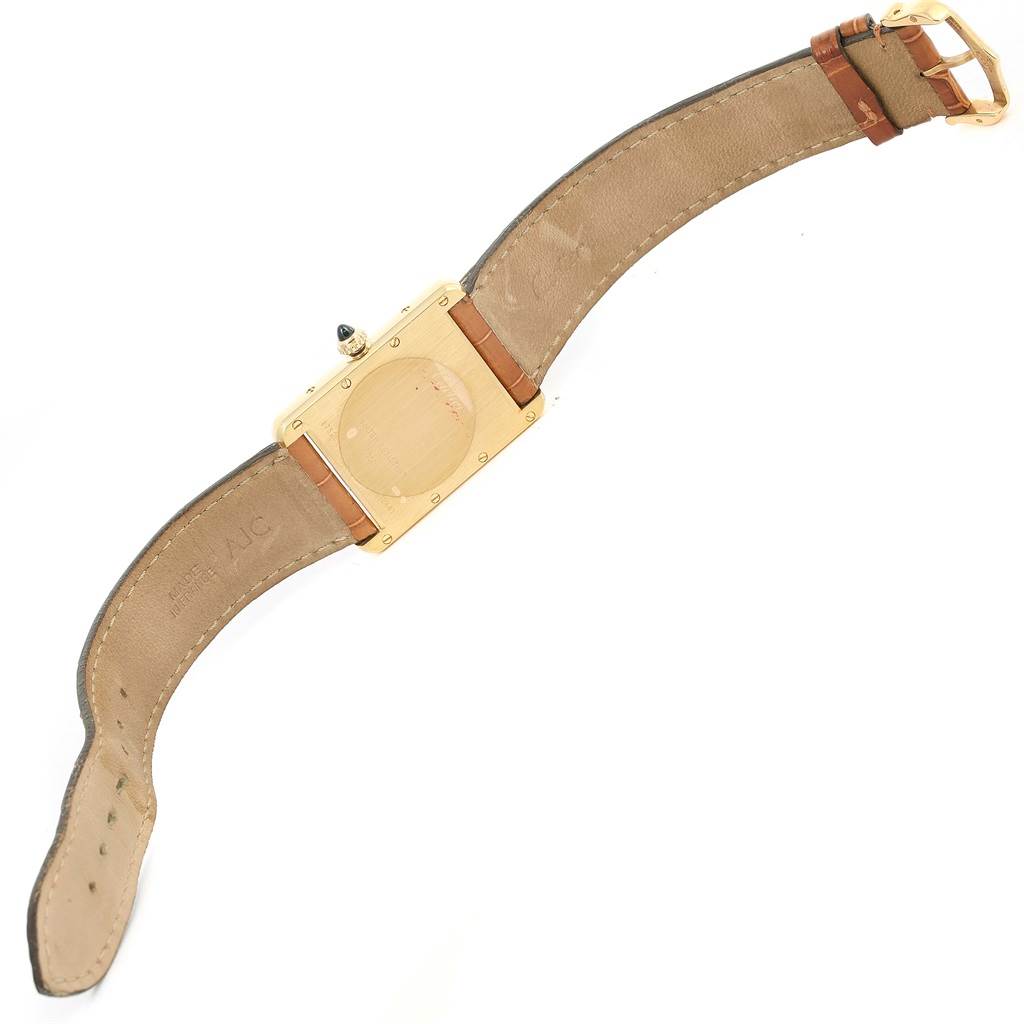 The image shows the back of a Cartier Tank Louis W1529756 Yellow Gold Silver Dial W1529756 Yellow Gold Silver Dial model watch, including the leather strap and buckle.