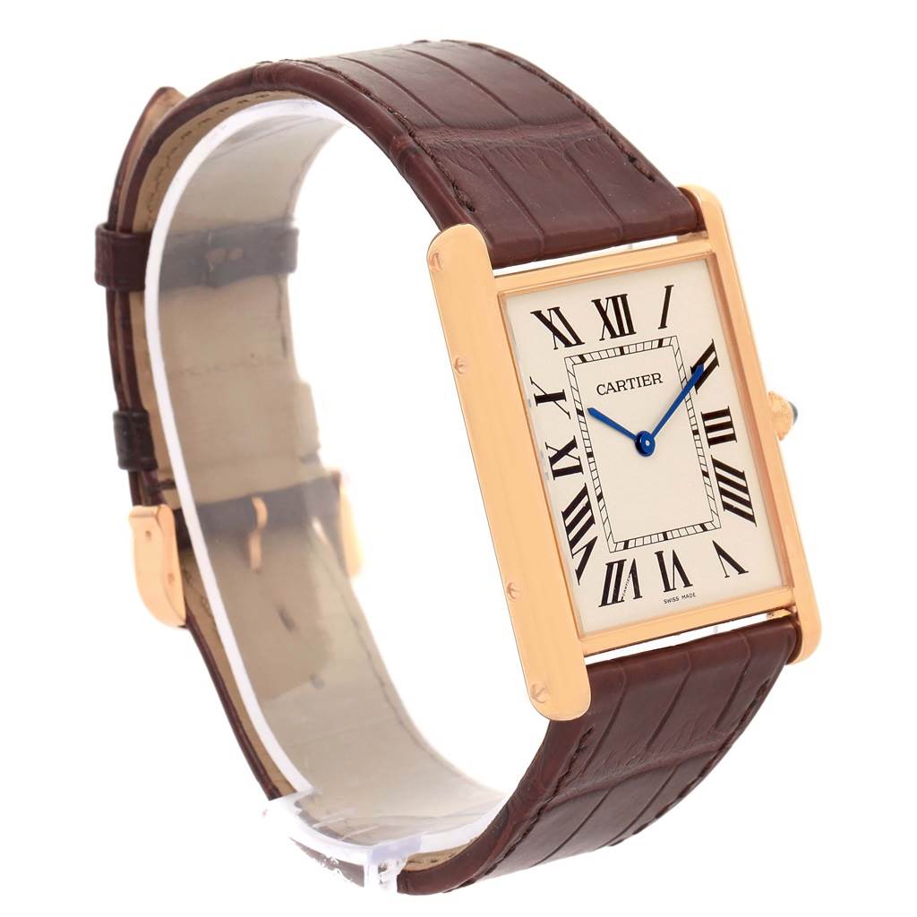 The Cartier Tank Louis W1560017 Rose Gold Silver Dial W1560017 Rose Gold Silver Dial watch is shown at an angle highlighting its rectangular face, Roman numeral dial, and leather strap.