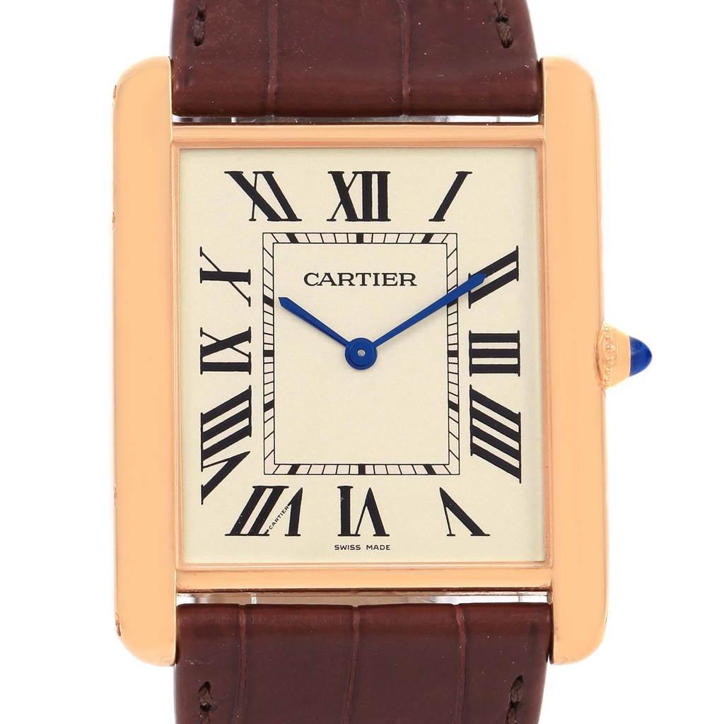 This image shows a face-on view of the Cartier Tank Louis W1560017 Rose Gold Silver Dial W1560017 Rose Gold Silver Dial watch, featuring the dial, blue hands, and part of the brown strap.