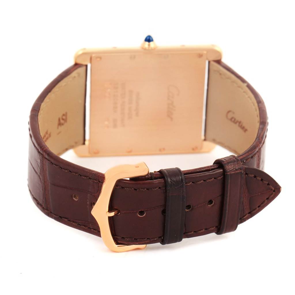 The image shows the back view of a Cartier Tank Louis W1560017 Rose Gold Silver Dial W1560017 Rose Gold Silver Dial watch highlighting its leather strap and the clasp.