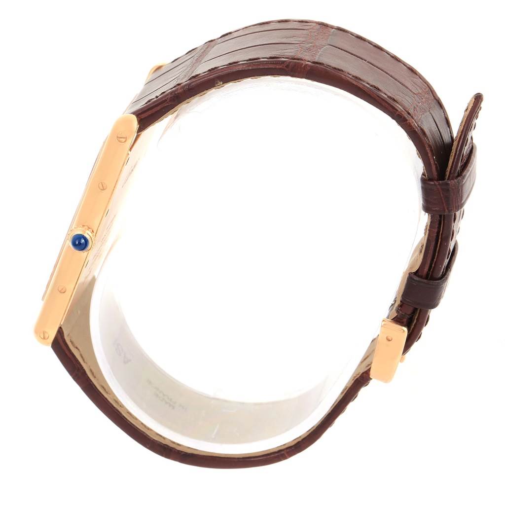 The image shows a side view of a Cartier Tank Louis W1560017 Rose Gold Silver Dial W1560017 Rose Gold Silver Dial watch, highlighting the crown, case, and leather strap.