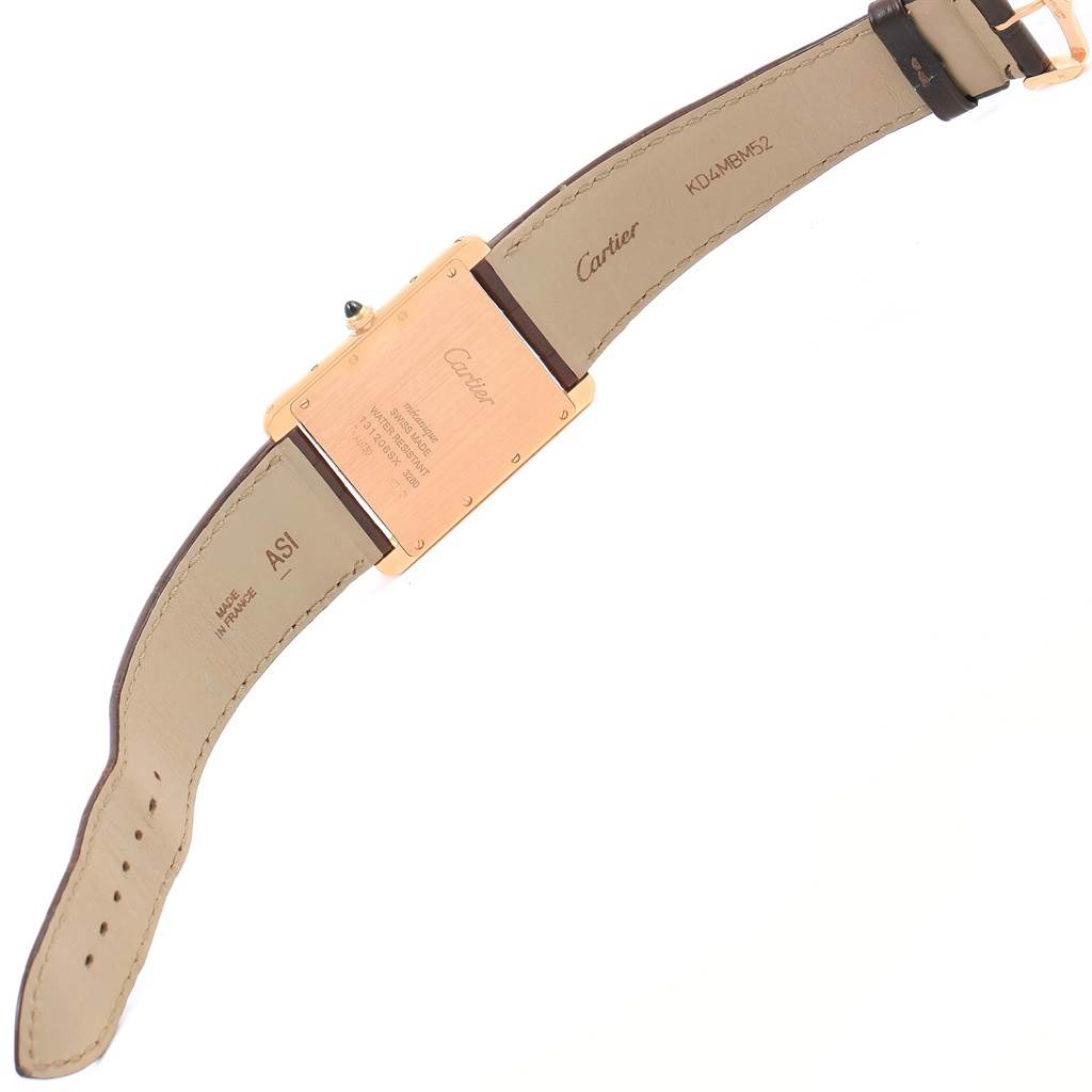 The image shows the back view of a Cartier Tank Louis W1560017 Rose Gold Silver Dial W1560017 Rose Gold Silver Dial watch, highlighting its case back, strap, and buckle.