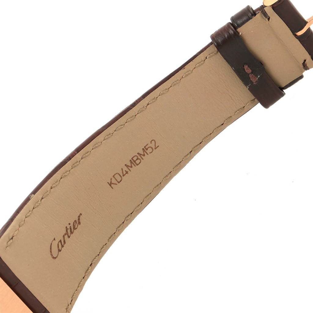 The image shows the underside of the leather strap for a Cartier Tank Louis W1560017 Rose Gold Silver Dial W1560017 Rose Gold Silver Dial watch, displaying the brand name and model number.
