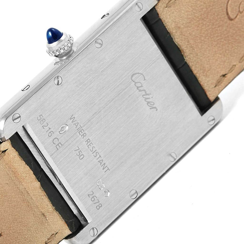 The image shows the back casing and strap of a Cartier Tank Louis W1540956 White Gold Silver Dial W1540956 White Gold Silver Dial watch, with visible branding and serial information.