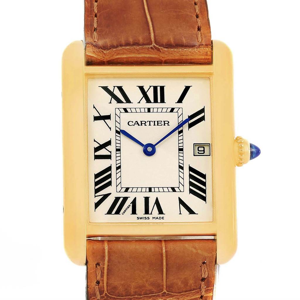 The image shows a front view of a Tank Louis watch by Cartier, highlighting the face, hands, Roman numerals, and a portion of the leather strap.