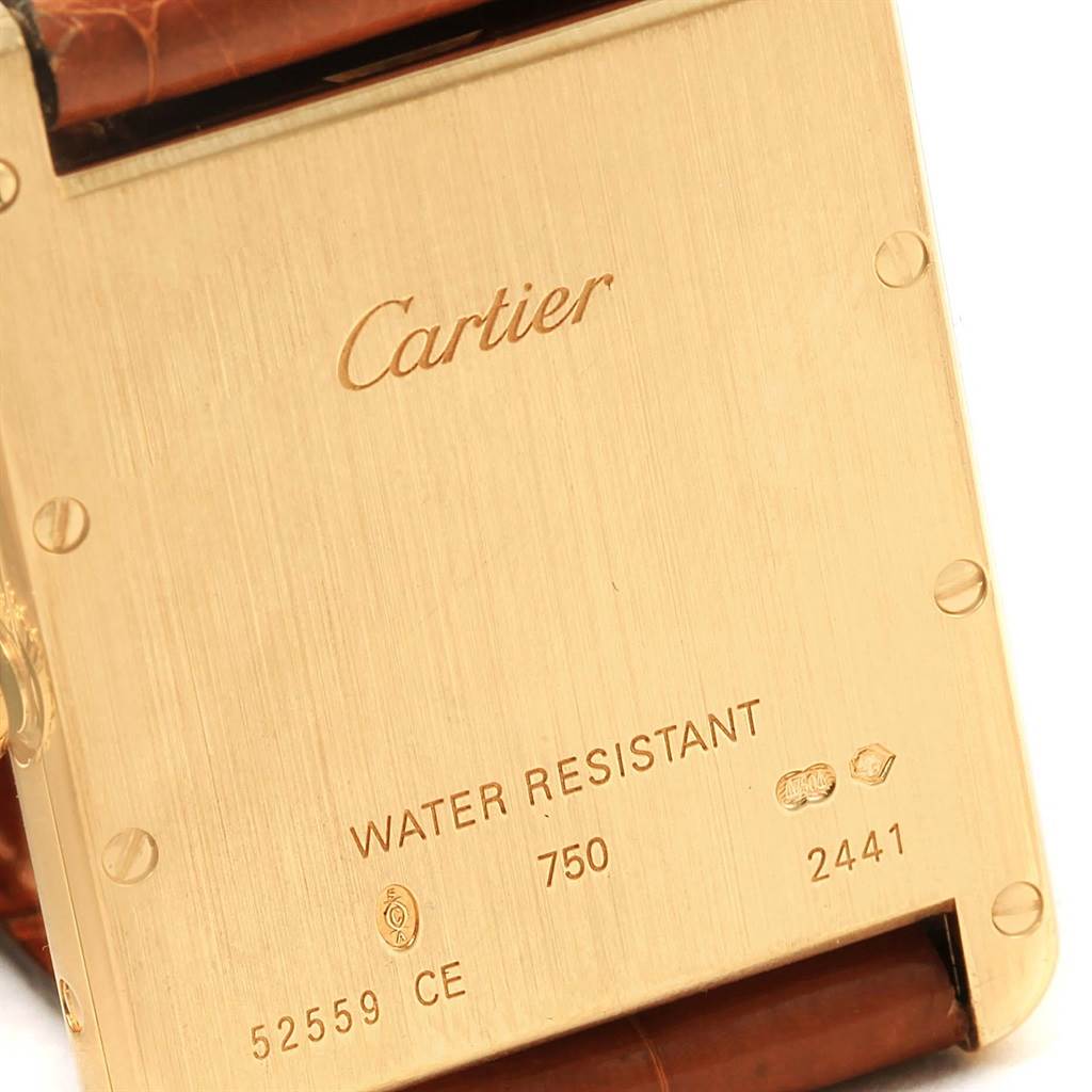 The image shows the case back of a Cartier Tank Louis W1529756 Yellow Gold Silver Dial W1529756 Yellow Gold Silver Dial watch, highlighting branding and specifications.