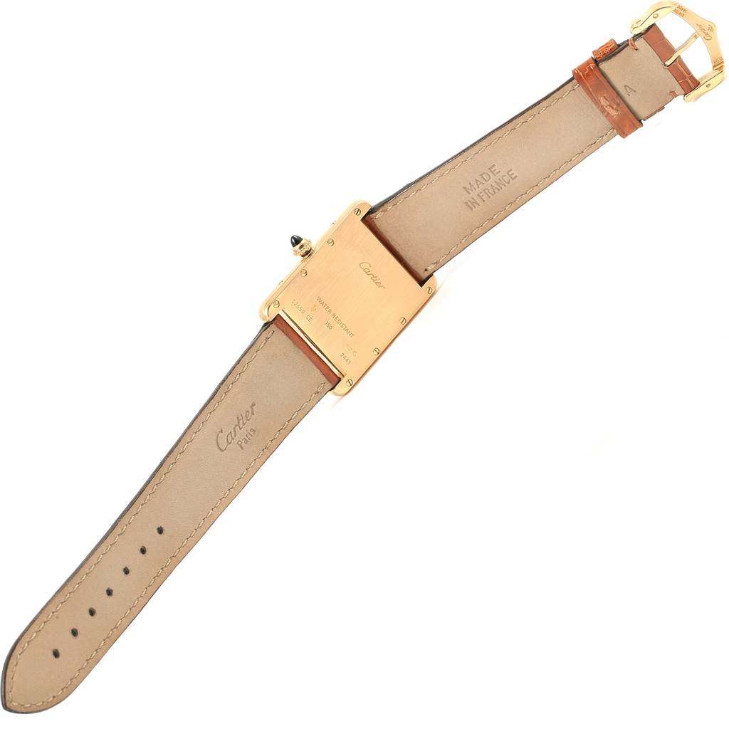 The image shows the back and strap of a Cartier Tank Louis W1529756 Yellow Gold Silver Dial W1529756 Yellow Gold Silver Dial watch, angled to display the clasp and markings.