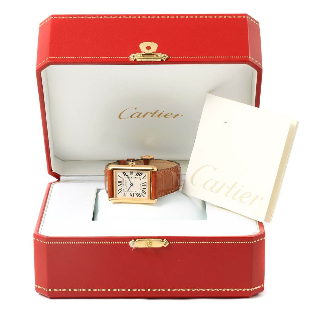 The image shows a Cartier Tank Louis W1529756 Yellow Gold Silver Dial W1529756 Yellow Gold Silver Dial watch in its open red box, alongside a Cartier booklet.