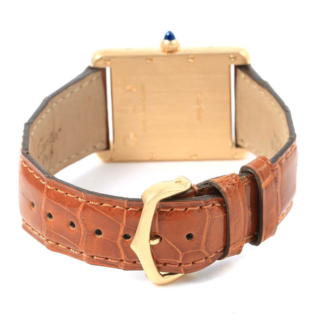 This image shows the back view of a Cartier Tank Louis W1529756 Yellow Gold Silver Dial W1529756 Yellow Gold Silver Dial watch, highlighting the buckle and leather strap.