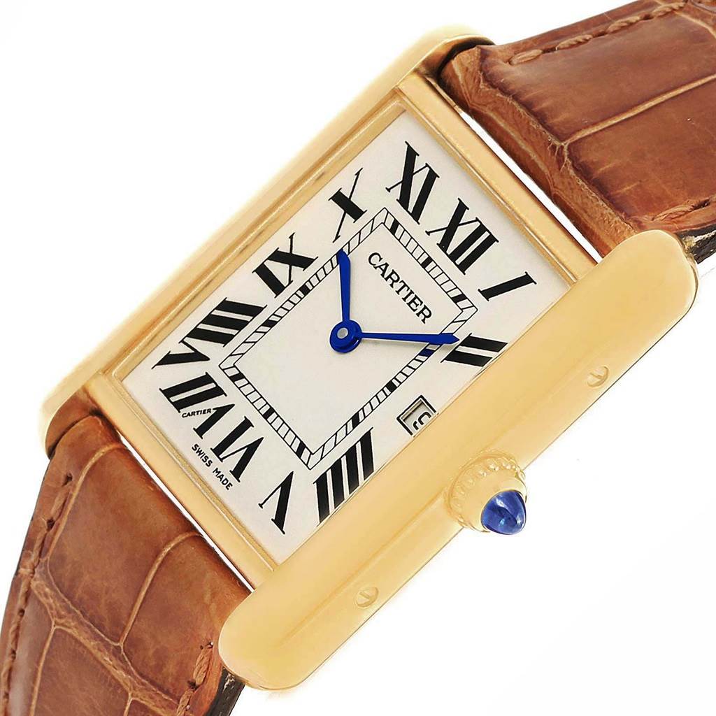This image shows a Tank Louis model by Cartier at an angled view focusing on the watch face, bezel, crown, and leather strap.