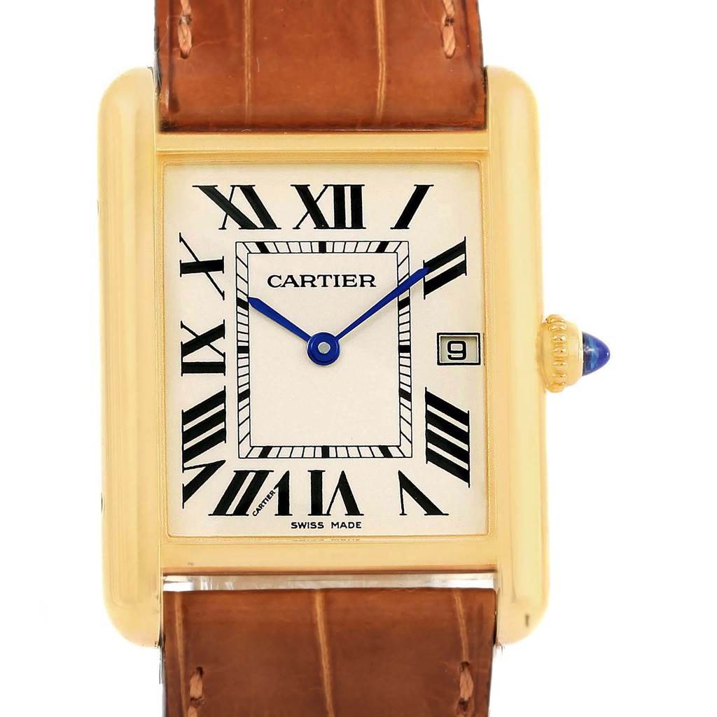 This image shows a frontal view of the Cartier Tank Louis W1529756 Yellow Gold Silver Dial W1529756 Yellow Gold Silver Dial watch, revealing the dial, Roman numerals, and a blue cabochon crown.
